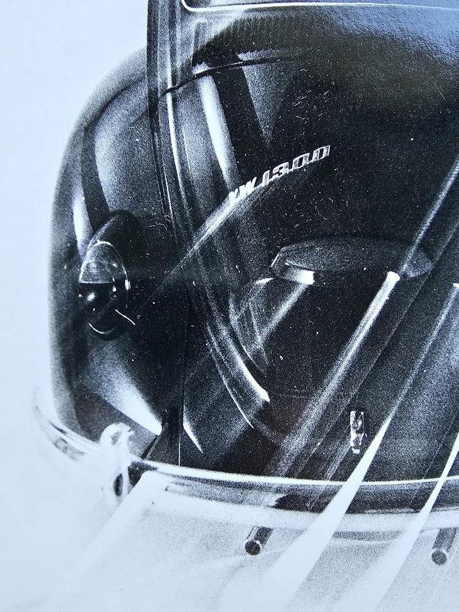 Studio shot of a Volkswagen Beetle whizzing off, by Michael Joseph