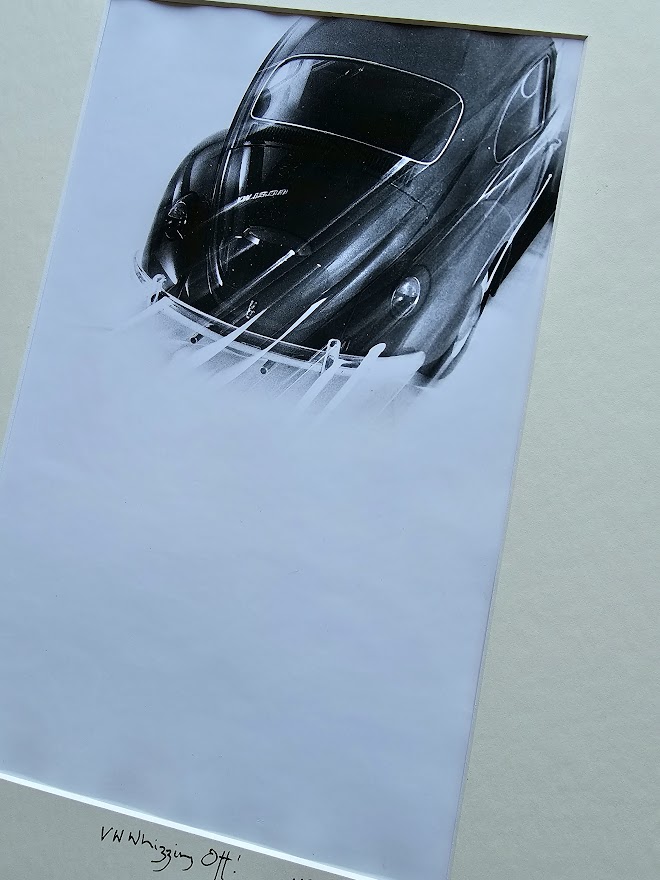 Studio shot of a Volkswagen Beetle whizzing off, by Michael Joseph