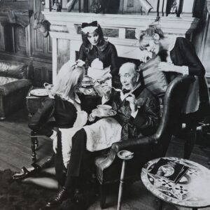 Sterotypical lord of manor with maids serving Maggi - advertisement test print by Michael Joseph