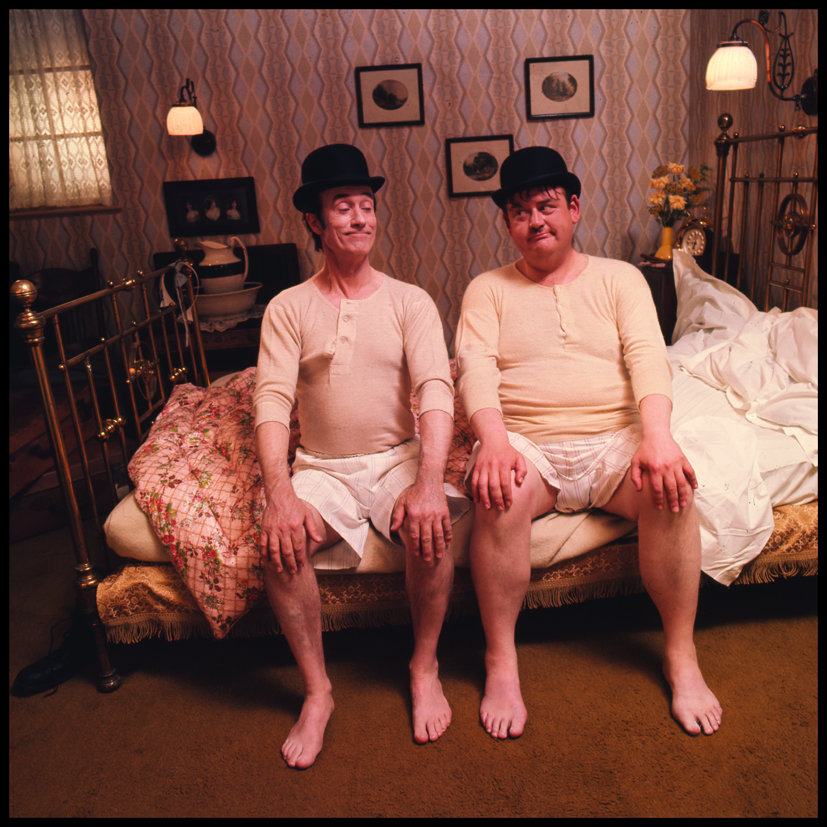 Laurel and Hardy lookalikes for Tubstem french sock company, comedians on brass bed by Michael Joseph