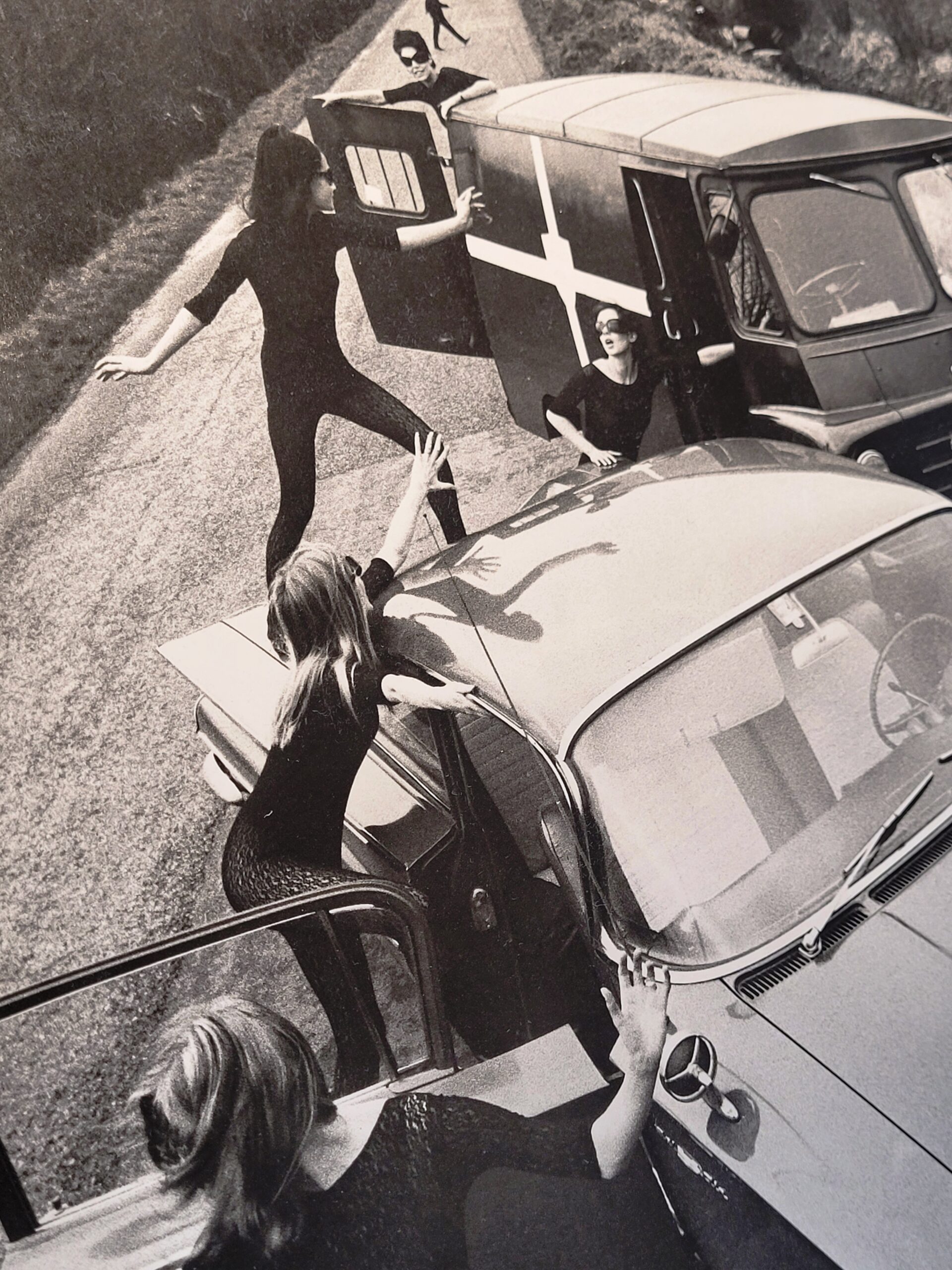 Acrilan sixties country road-block, rebellious sunglass-bearing gals and vehicles, by Michael Joseph