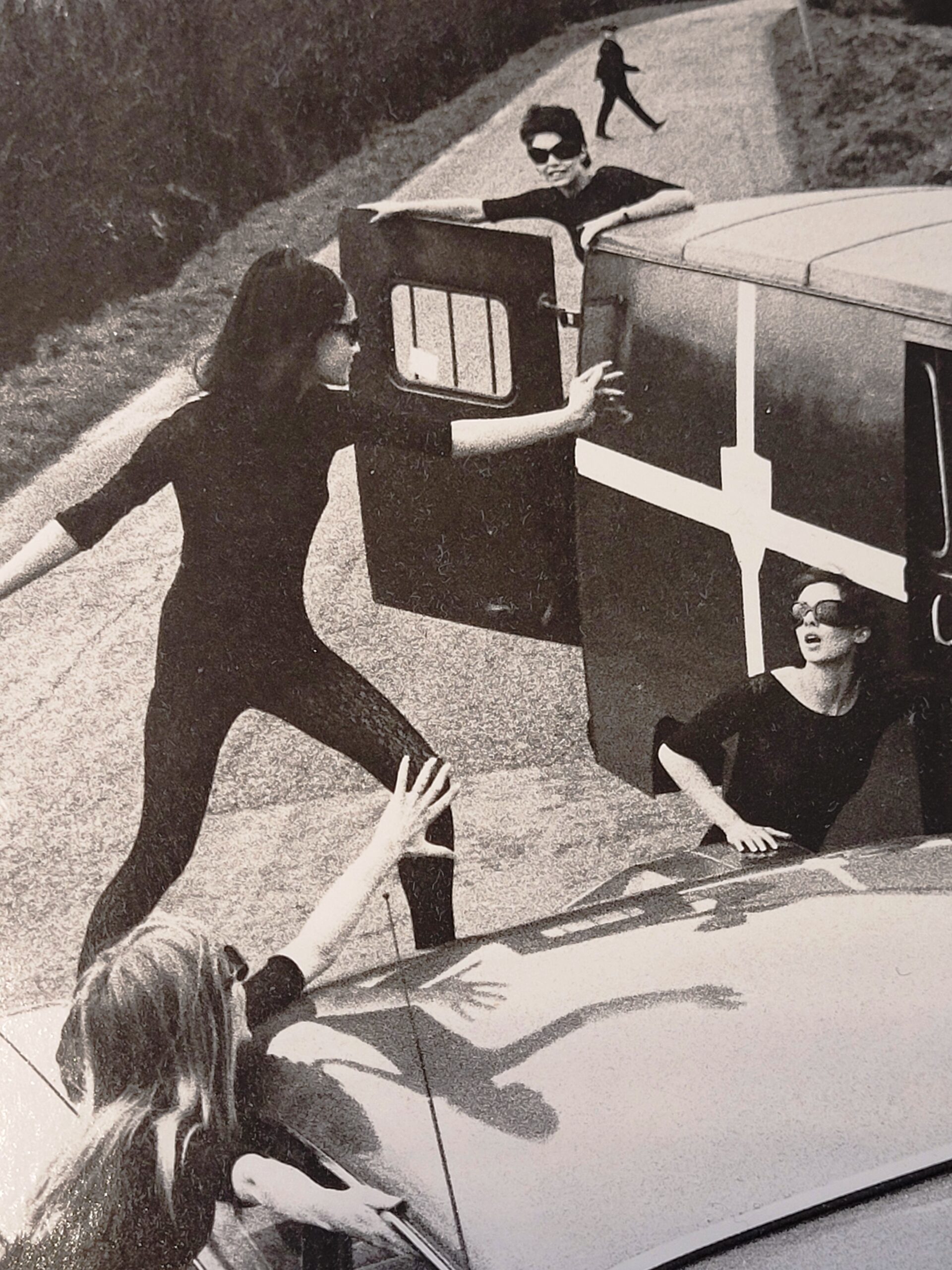 Acrilan sixties country road-block, rebellious sunglass-bearing gals and vehicles, by Michael Joseph
