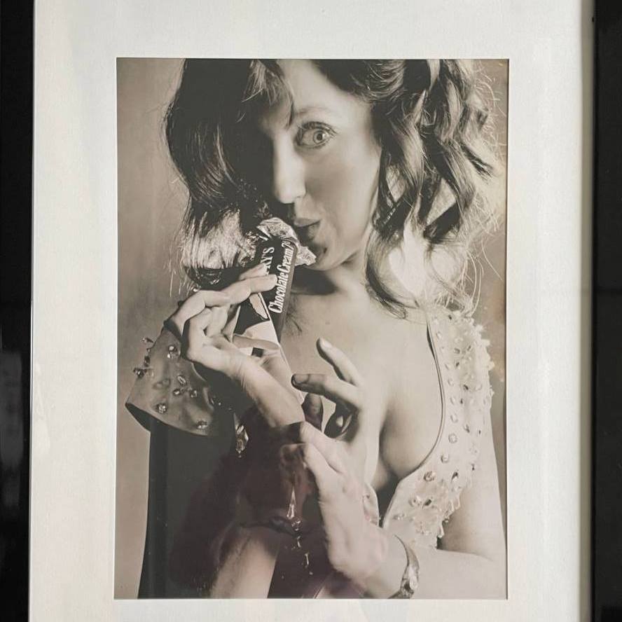 Happy lady enjoying her bar of chocolate by Michael P Joseph