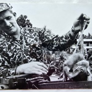Soldier and animal on lead in Saigon, taken during Vietnam war, 1965 authentic darkroom print by Michael Joseph