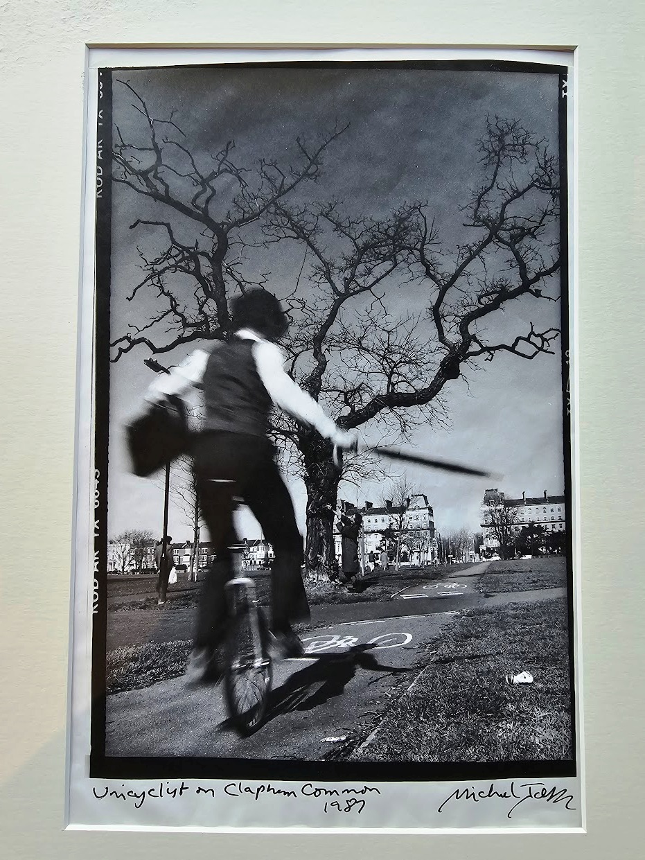 Clapham Unicyclist - commuter on way to work, black and white darkroom print on Kodalith ultra-thin paper, by Michael Joseph