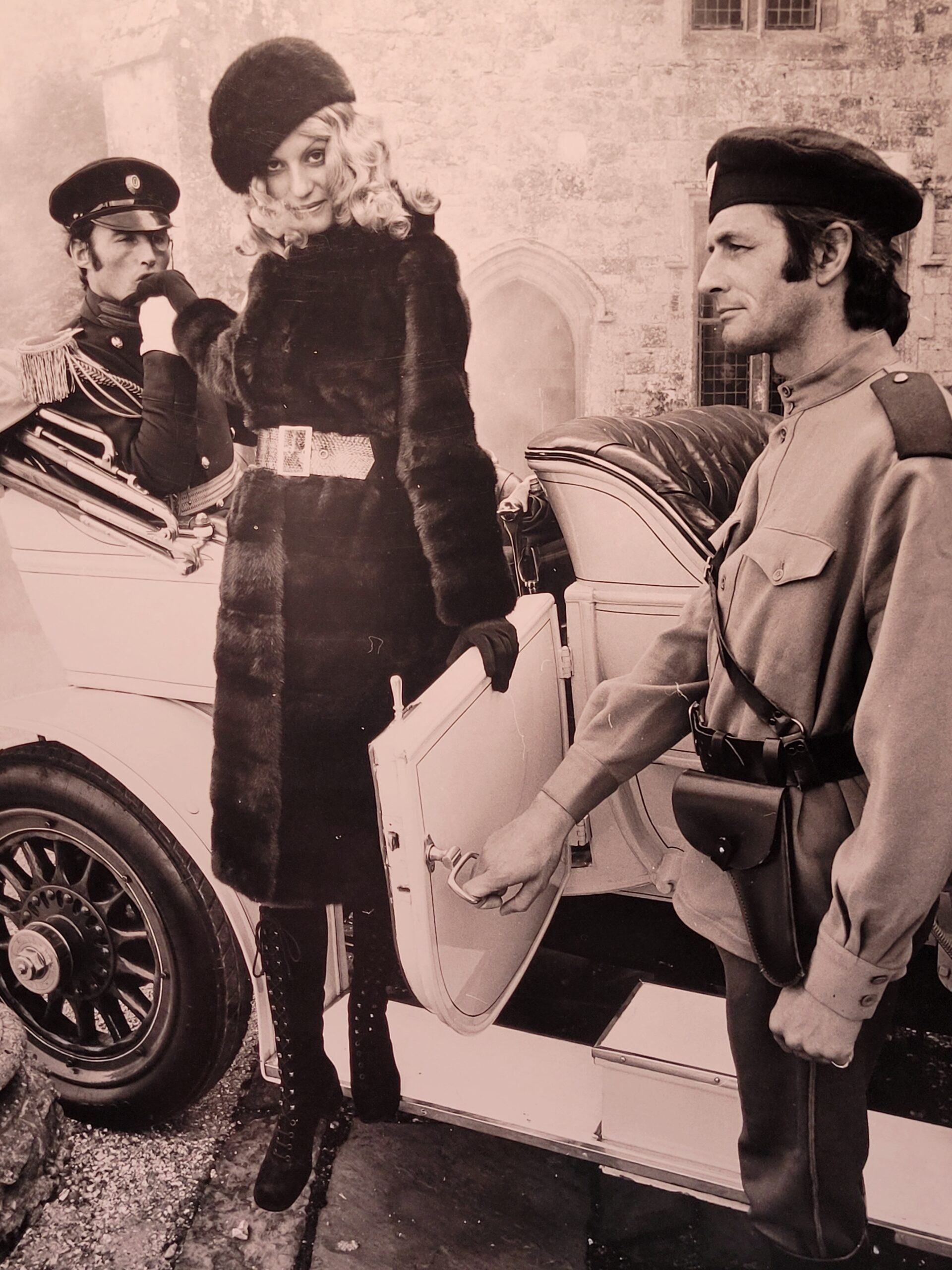 Fur to be fumbled in, advert from the sixties, sexy lady leaving car with army officer in front of château, by Michael Joseph
