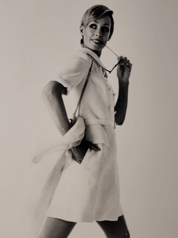 Pretty blonde model holding her glasses with her teeth, say oh really - only by Michael Joseph