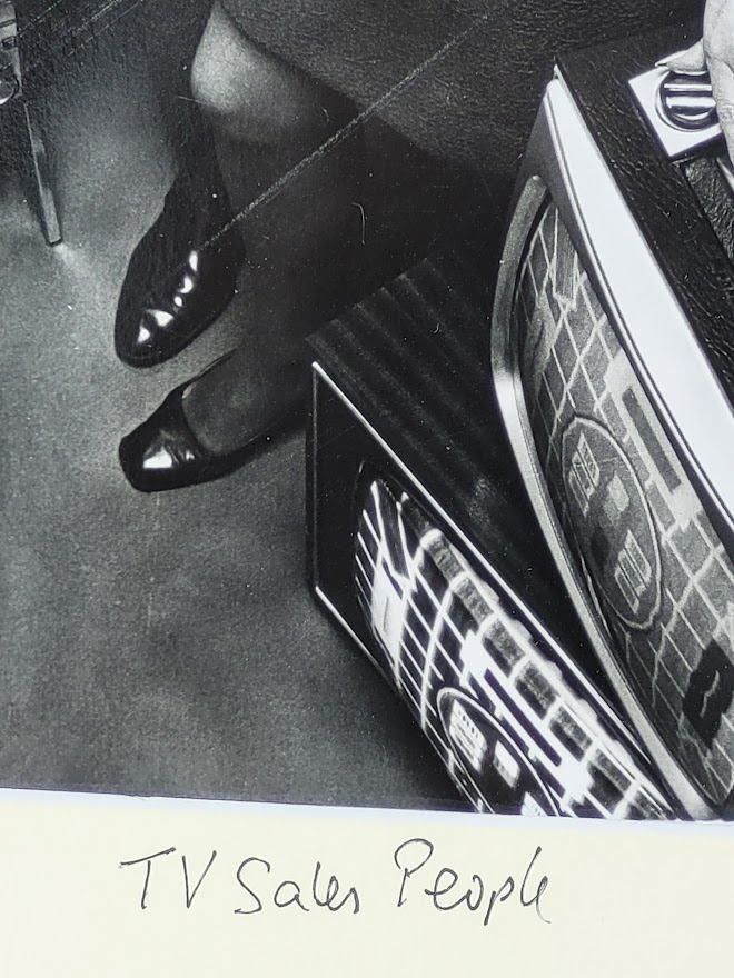 Sixties television sales people with several televisions, by Michael Joseph