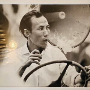 Smoker at the wheel in Qui Nhon, Vietnam, darkroom print by Michael Joseph