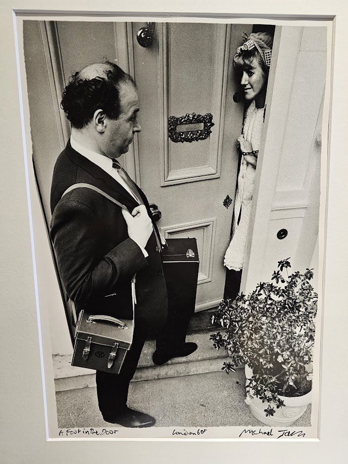 Foot in the door, salesman with briefcase at lady in curlers' house in the sixties test print by Michael Joseph