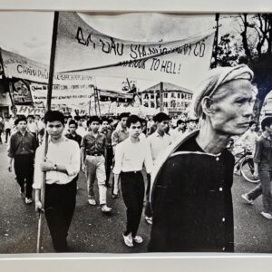 Calm student rally Saigon people protesting in the street during the Vietnam War by Michael Joseph