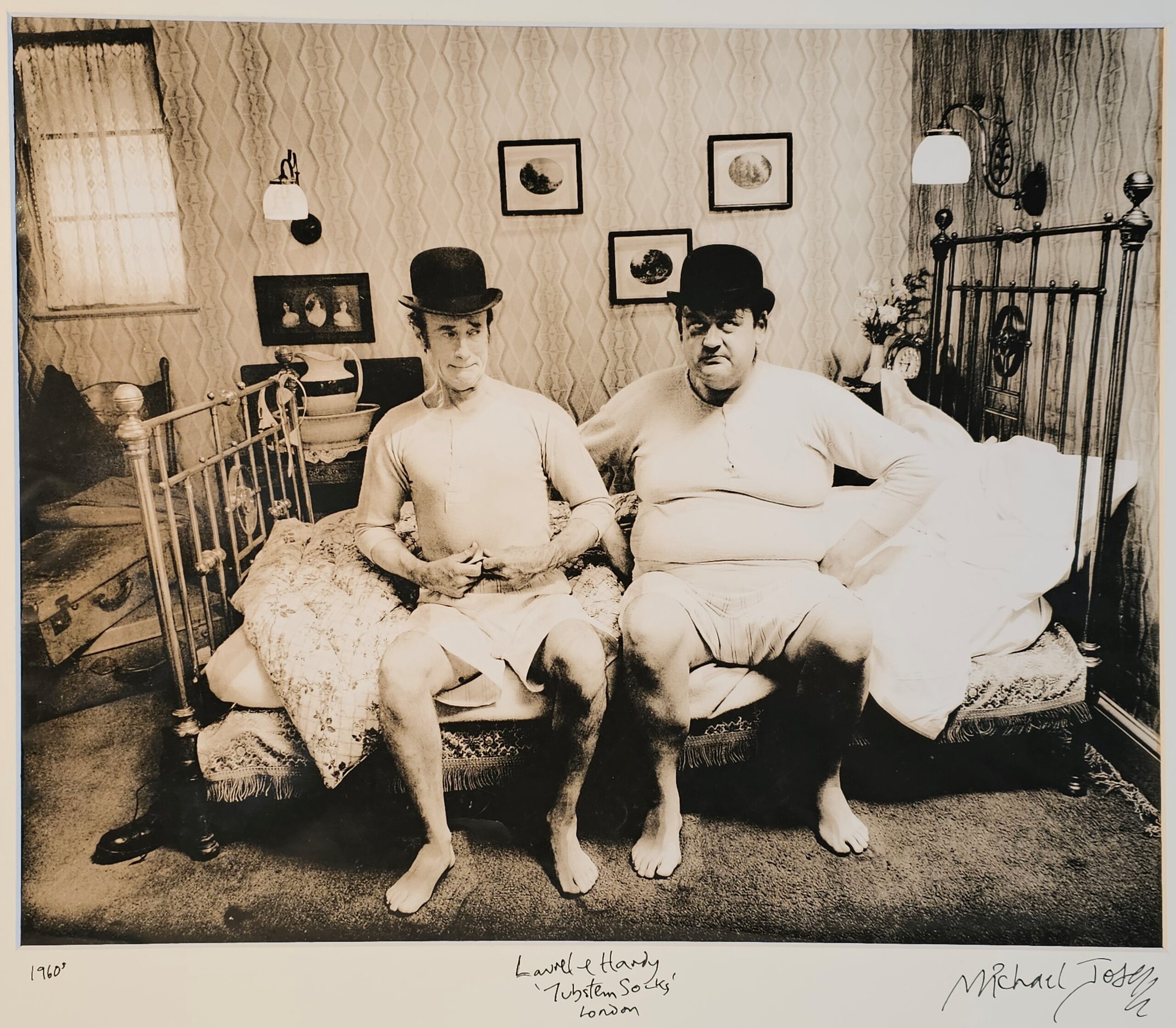 Laurel and Hardy lookalikes on a bed, Tubstem socks advert, test print by Michael Joseph