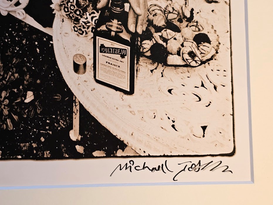 Cointreau advert, couple in folie pergola, metal structure with climbing rose vegetation and cast iron chairs by Michael Joseph