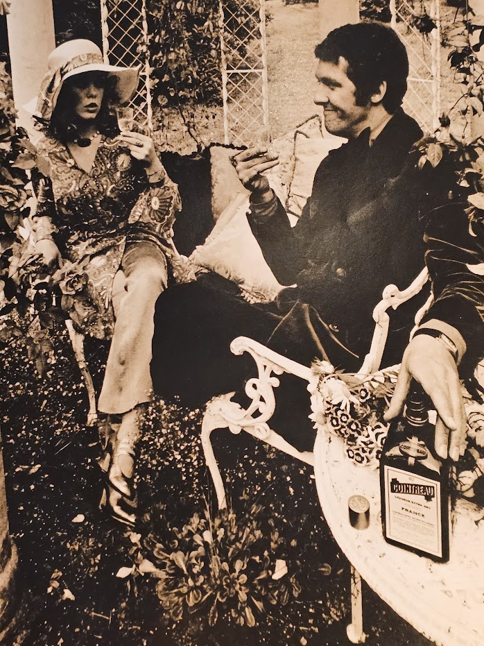 Cointreau advert, couple in folie pergola, metal structure with climbing rose vegetation and cast iron chairs by Michael Joseph