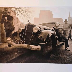 Esso getaway - men toting machine guns in the East end of London in the sixties by Michael Joseph