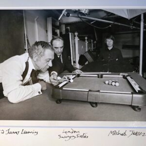 Sid James playing pool on a mini table, test-print for an advert by Michael Joseph