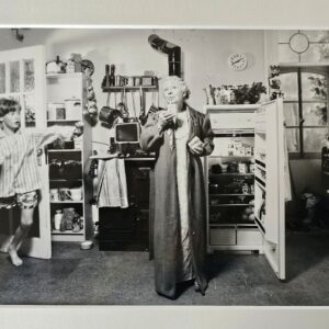 Child enters kitchen to catch Granny having a midnight snack by Michael Joseph