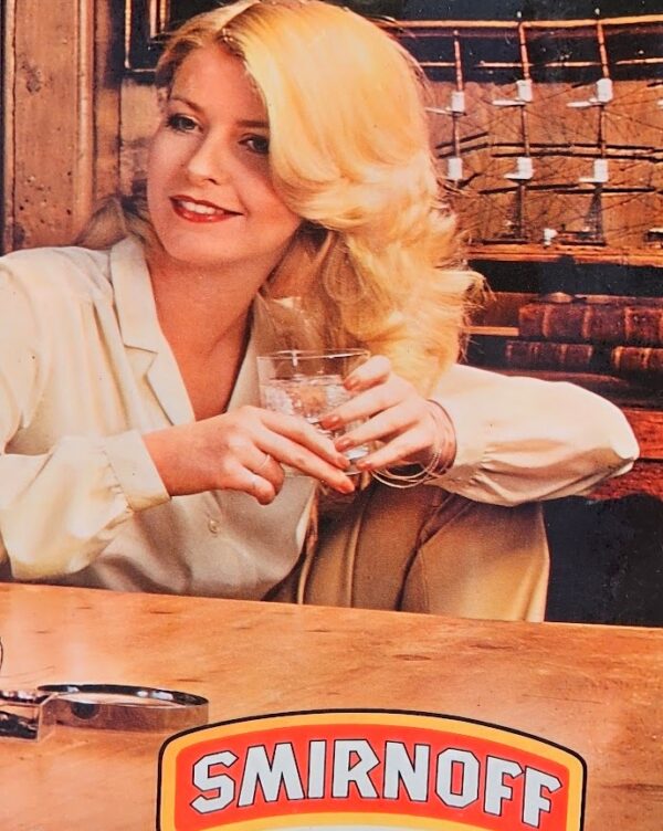 Shipbuilding and Smirnoff... leave me breathless! Vodka advertisement from the 1970s, bearded modelmaker and sexy blonde by Michael Joseph