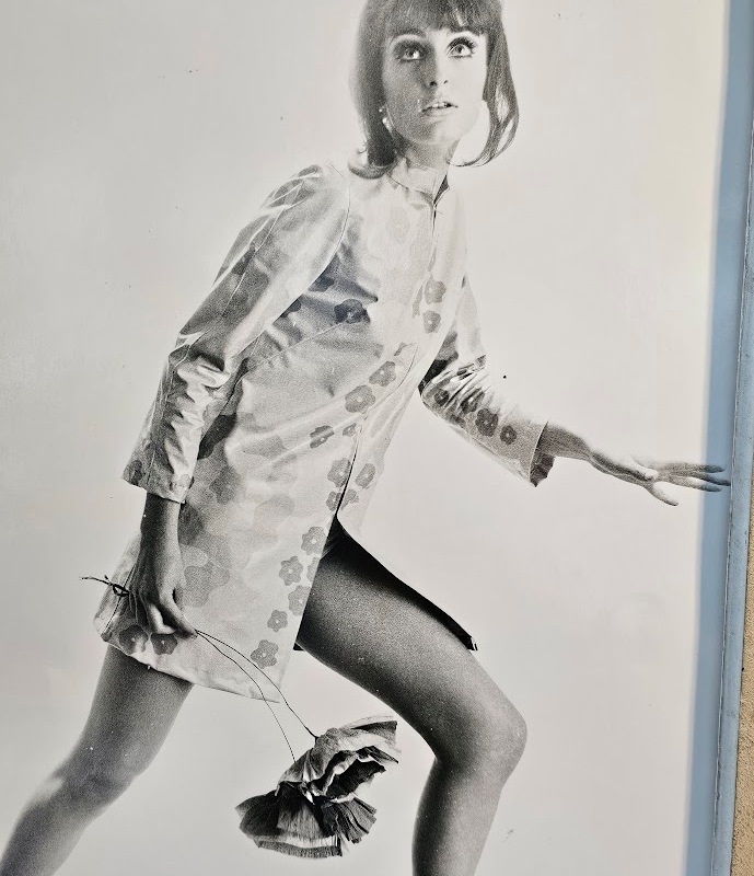 Jovial model, barefoot with big flowers, authentic darkroom print by Michael Joseph in an upcycled copper tint wooden frame