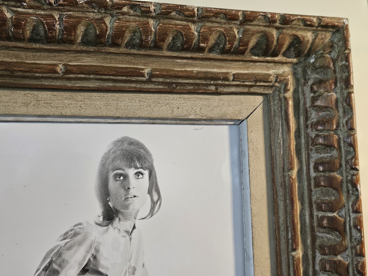 Jovial model, barefoot with big flowers, authentic darkroom print by Michael Joseph in an upcycled copper tint wooden frame