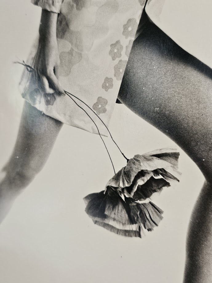 Jovial model, barefoot with big flowers, authentic darkroom print by Michael Joseph in an upcycled copper tint wooden frame