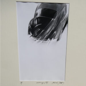 Studio shot of a Volkswagen Beetle whizzing off, by Michael Joseph