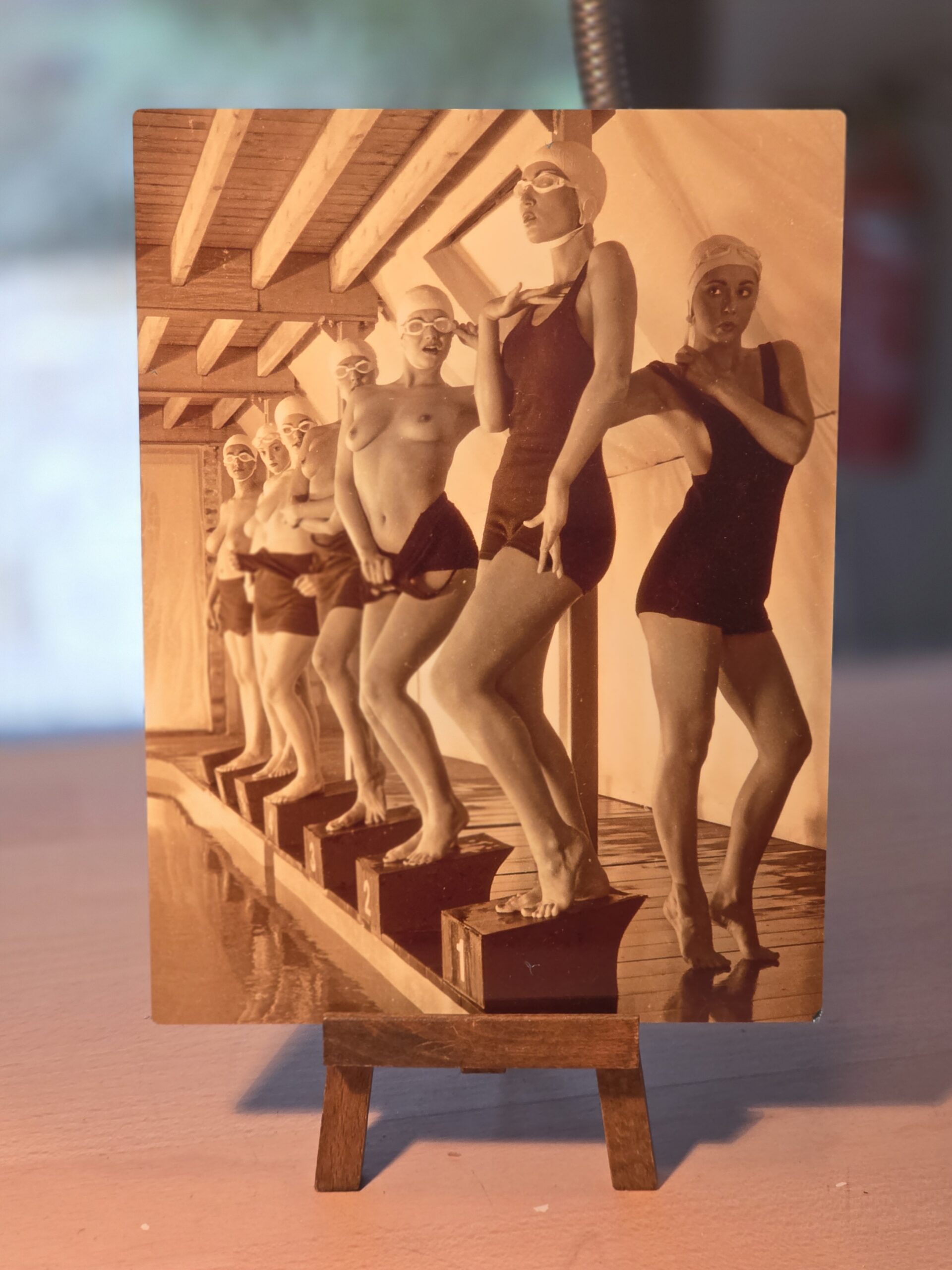 Cheeky Pool Ladies in Cozzies Between Takes - print on aluminium, photo by Michael Joseph