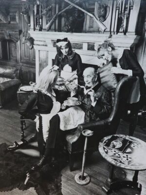 Sterotypical lord of manor with maids serving Maggi - advertisement test print by Michael Joseph
